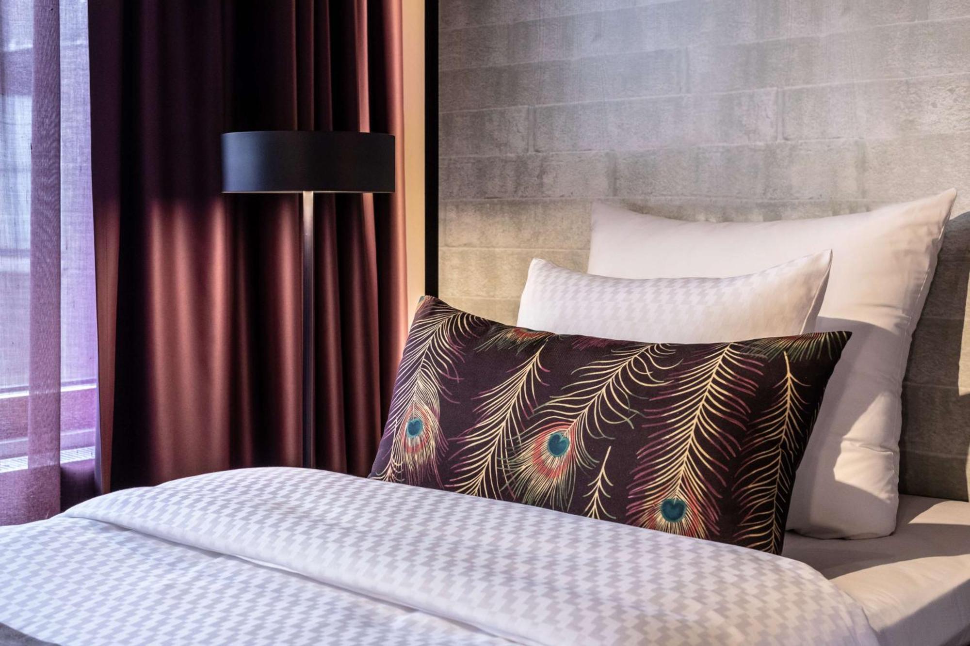 Marski By Scandic Helsinki Exterior photo A pillow with a peacock feather print
